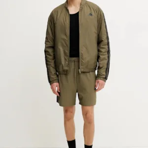 adidas kurtka Essential kolor zielony przejściowa JJ1202